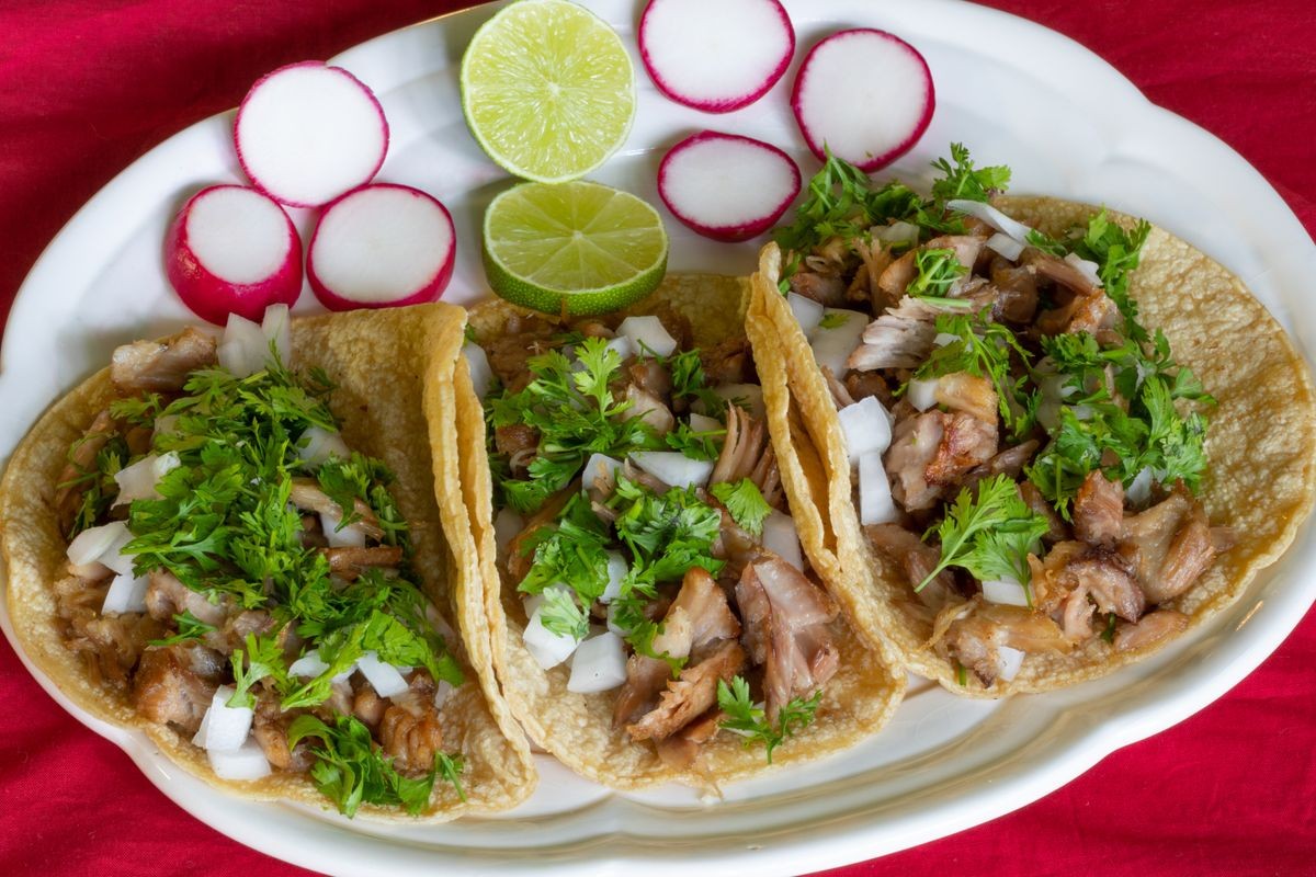 Carnitas Tacos, Tacos made with pork meat onions, cilantro, lemon and radish Carnitas Tacos, Tacos made with pork meat onions, cilantro, lemon and radish